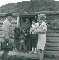 Ganado nurse unknown and Navajo driver at a hogan on the Navajo Reservation